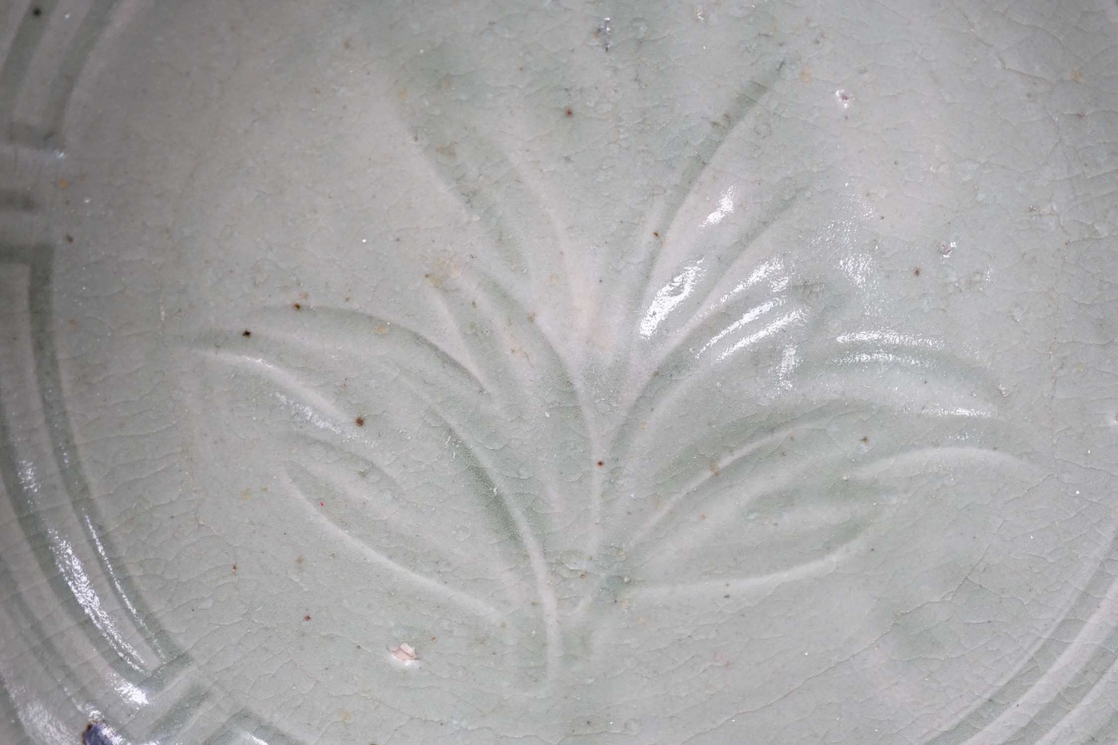 A Chinese Celadon charger. 34cm diameter